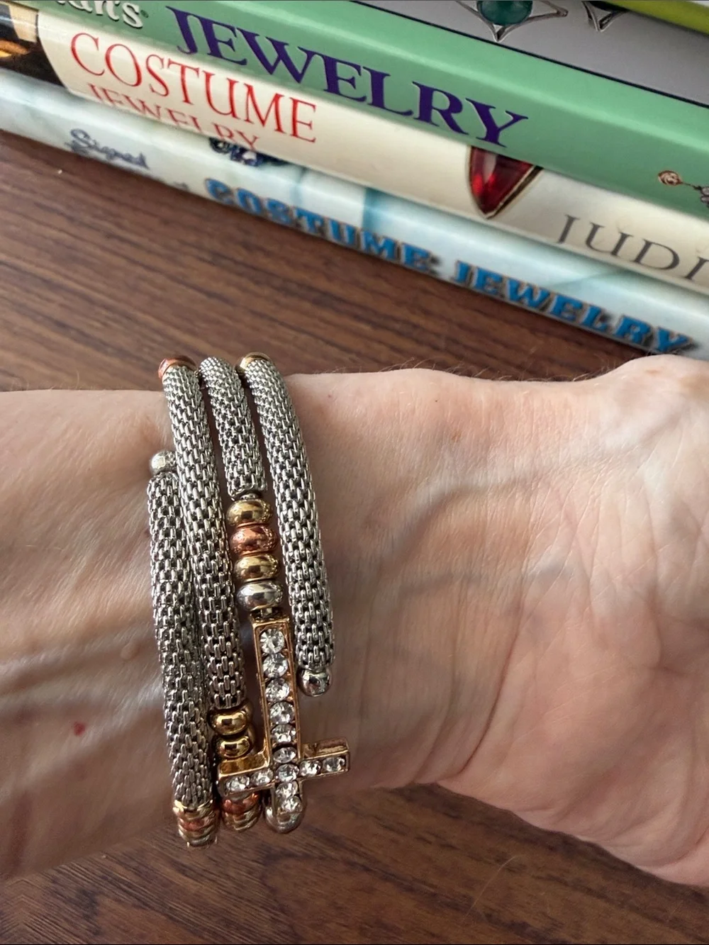 Silver Tone Coil Bracelet with 3 Rhinestone Crosses & Tri Color Beads.